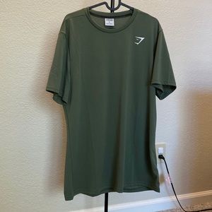 Olive green colored Gymshark shirt size XL